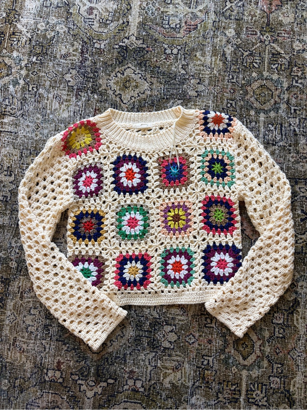 Crochet sweater with flowers
